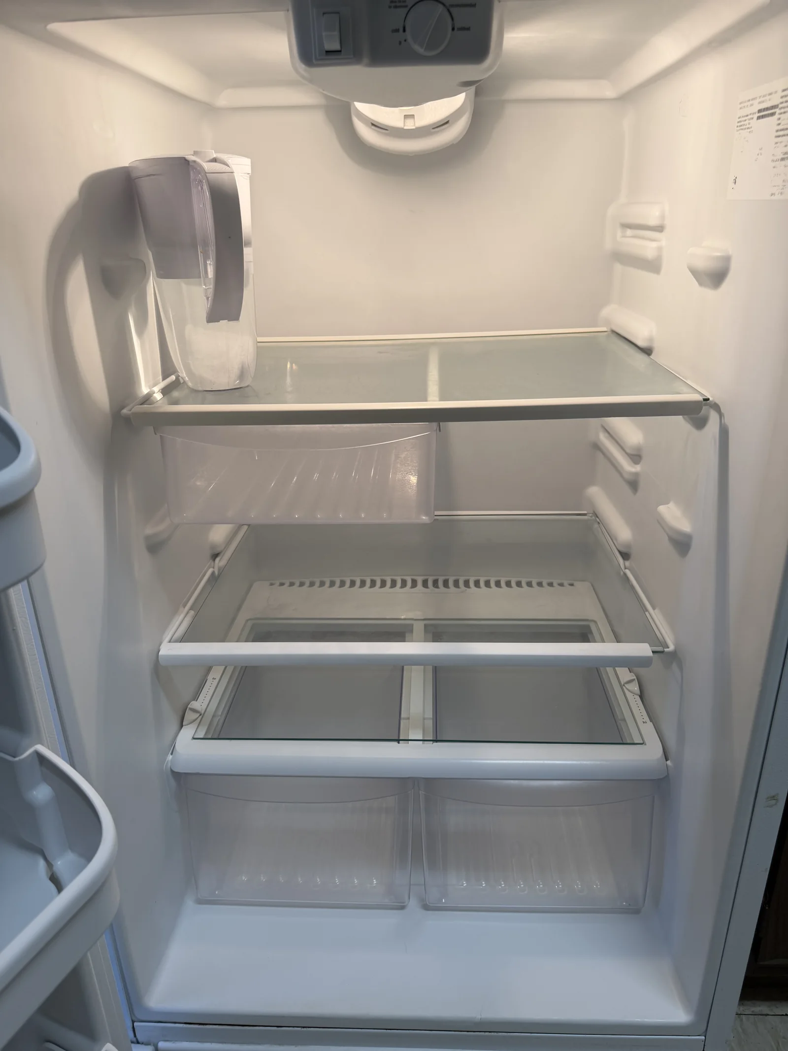 Client-provided after photo showing the cleaned refrigerator interior